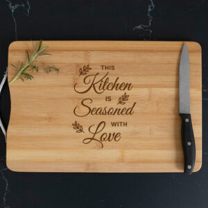 this kitchen is seasoned with love chopping board